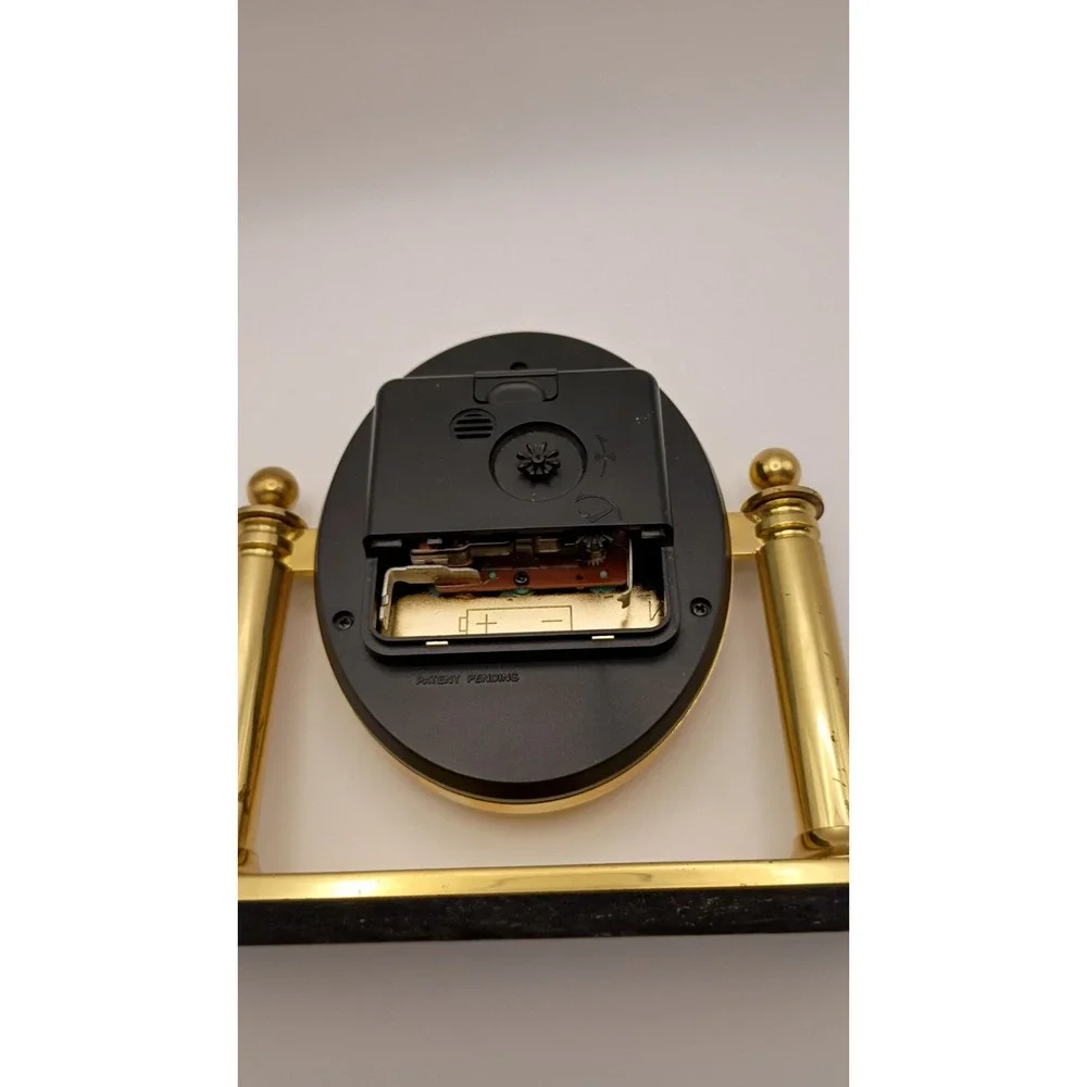 Linden Quartz Oval Desk Clock Gold Tone Swivel Pillar Mantle Timepiece
